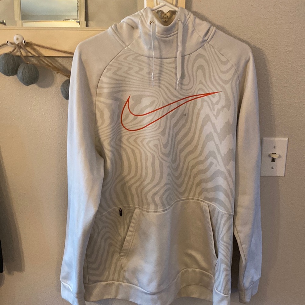 Nike sweatshirt with two marks one on the front and back.